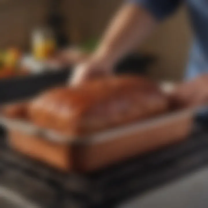 The Copper Chef Meatloaf Pan being cleaned, illustrating its easy maintenance.