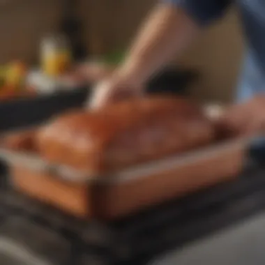 Effortless Maintenance of the Copper Chef Meatloaf Pan The Copper Chef Meatloaf Pan being cleaned, illustrating its easy maintenance.