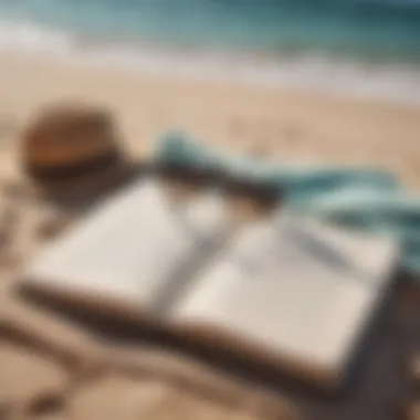 A pair of sunglasses on top of an open book on a beach towel