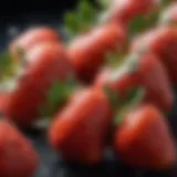 A close-up view of fresh strawberries with droplets of water on their surface, showcasing their vibrant red color and texture.