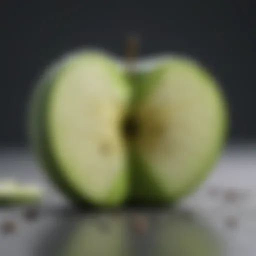 Juicy green apple sliced in half with seeds exposed