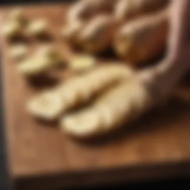 Ginger root sliced on a wooden cutting board