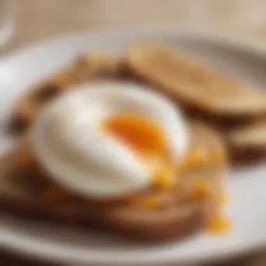 A close-up of a perfectly poached egg on whole grain toast