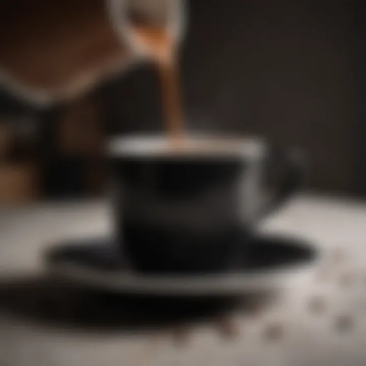 Black coffee being poured into a stylish ceramic cup