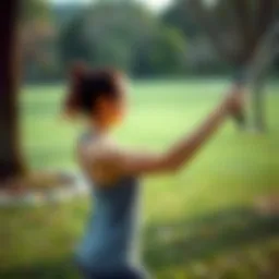 An energetic woman executing a resistance band workout in a serene park setting