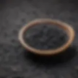 A close-up of activated charcoal in a bowl, highlighting its texture and color.