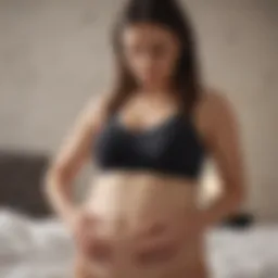 Expectant mother using pregnancy tracking app on smartphone