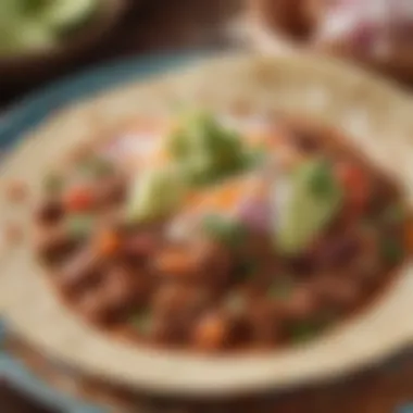 Close-up of birria taco filled with tender meat and fresh toppings