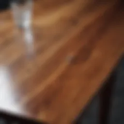 Reflective surface of a polished wood table with water spot removal technique